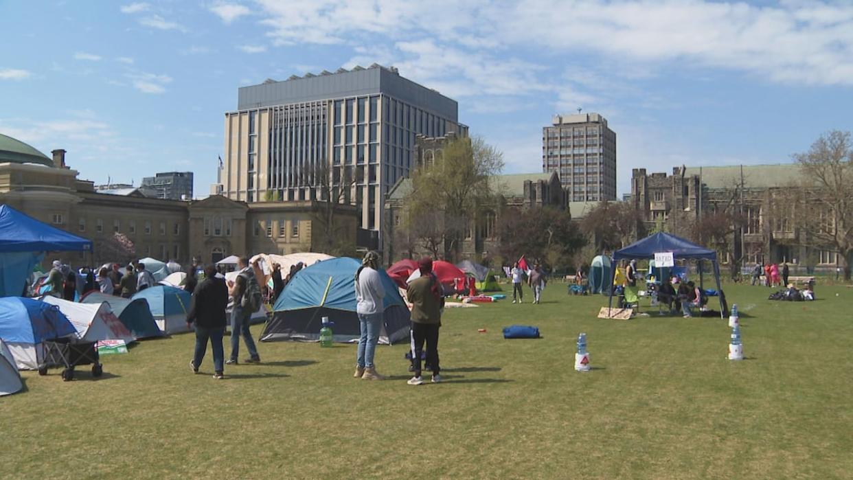 The pro-Palestinian student encampment is seen at U of T. Since the encampment was set up Thursday, thousands of alumni have signed a letter in support.  (Aizick Grimman/CBC - image credit)