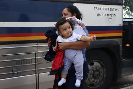 An undocumented immigrant family is released from detention at a bus depot in McAllen, Texas, U.S., June 22, 2018. REUTERS/Loren Elliott