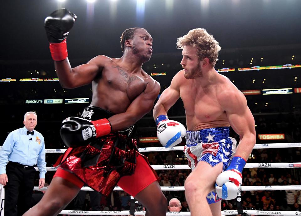 Logan Paul (red/white/blue shorts) and KSI (black/red shorts) exchange punches their pro debut cruiserweight fight at Staples Center on November 9, 2019 in Los Angeles, California. KSI won by decision.