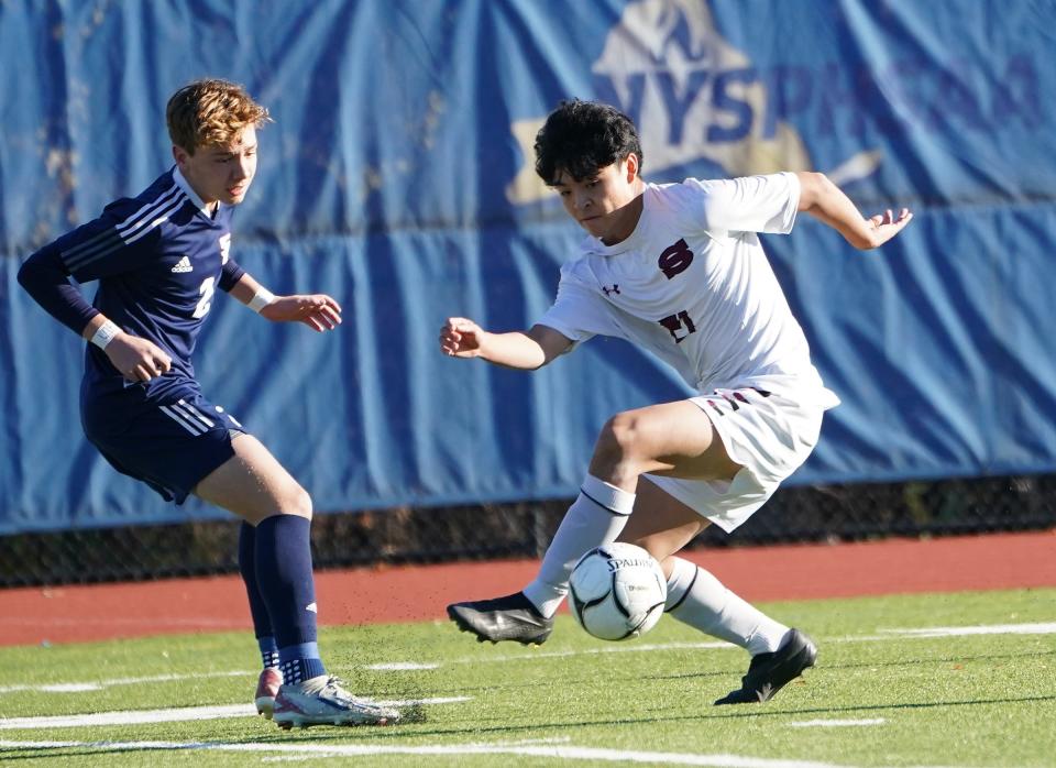 ScarsdaleÕs Yusuke Sato (21) works the ball during their 4-1 win over Smithtown West in the NYSPHSAA boys soccer Class AA semifinal at Middletown High School in Middletown on Saturday, November 2023.