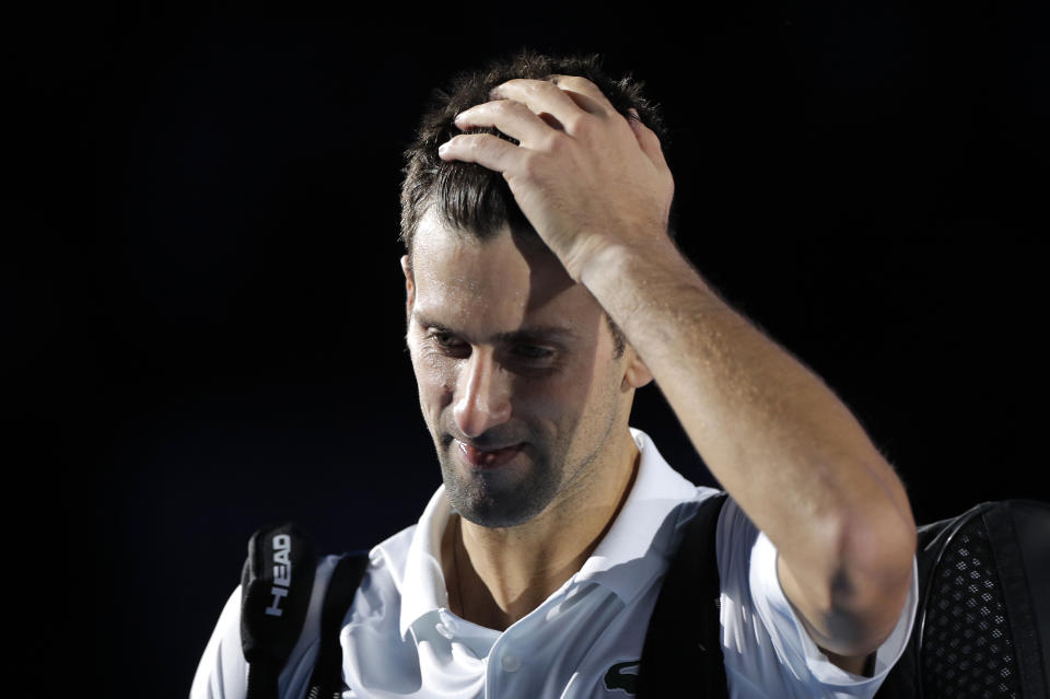 Tennis - ATP Finals - Pala Alpitour, Turin, Italy - November 20, 2021  Serbia's Novak Djokovic reacts after losing his semi final match against Germany's Alexander Zverev REUTERS/Guglielmo Mangiapane