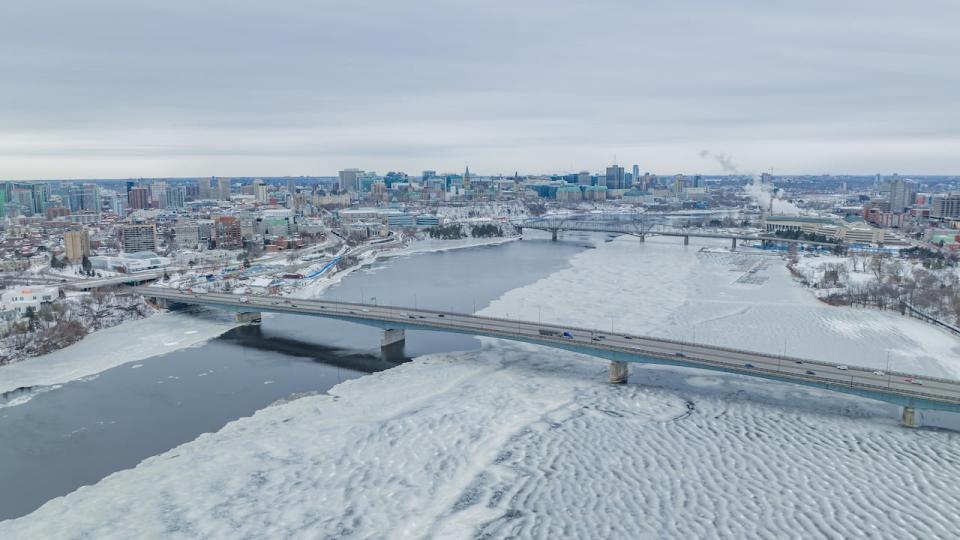 The Macdonald-Cartier Bridge between Ottawa and Gatineau, Que., is seen in the foreground of this drone photo taken on Jan. 11, 2024.