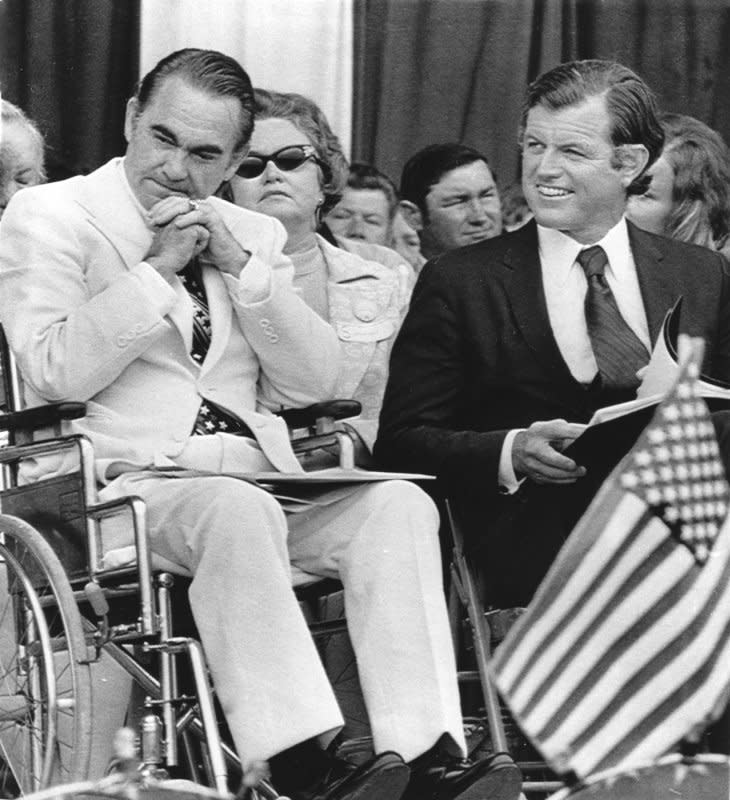 Alabama Gov. George Wallace is seen in a wheelchair with Massachusetts Sen. Edward Kennedy during an Independence Day event in Decatur, Ala., on on July 4, 1973. Wallace was paralyzed in an assassination attempt at a campaign rally a little over a year earlier. UPI Photo/File