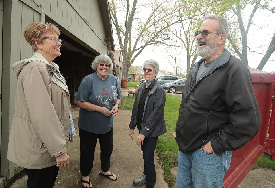 Siblings Debbie Sprit, Vivian Floom, Barbie Ream and Greg Floom share a laugh about their childhood at a farmhouse growing corn with their parents.