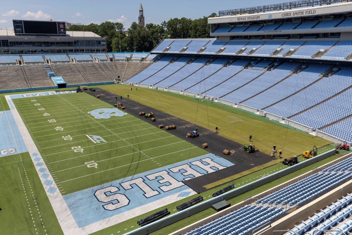 Crews from Carolina Green and the University of North Carolina Turf Management install nearly 100,000 square feet of fresh sod atop the artificial turf in Kenan Stadium in preparation for the FC Series game between Chelsea and Wrexham on Wednesday, July 12, 2023 in Chapel Hill, N.C. The Bermuda 419 sod was grown in Indian Trail, N.C., is 1.5 inches thick, and was installed upon a layer of geo-textile base over the artificial turf, which will be removed following the soccer match on July 19, 2023.