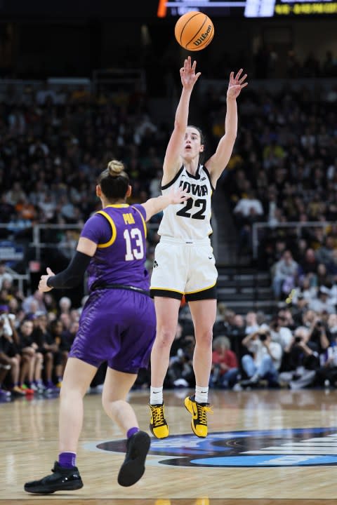 ALBANY, NEW YORK – APRIL 01: Caitlin Clark #22 of the Iowa Hawkeyes shoots a three point basket during the second half over Last-Tear Poa #13 of the LSU Tigers in the Elite 8 round of the NCAA Women’s Basketball Tournament at MVP Arena on April 01, 2024 in Albany, New York. (Photo by Andy Lyons/Getty Images)