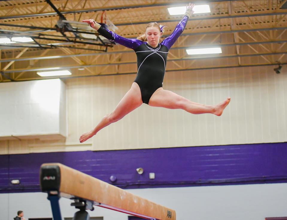 Bloomington South’s Chloe Gautier competes on the beam during the gymnastics meet against Bloomington North and Edgewood at South on Monday, Jan. 8, 2024.