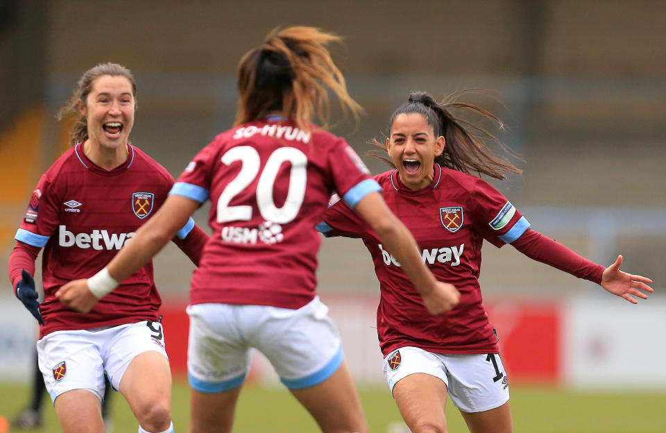 Cho So-Hyun of West Ham Ladies celebrates winning the penalty shoot out with Jane Ross and Rosie Kmita during the Women's FA Cup Semi Final match between Reading Women and West Ham United Ladies