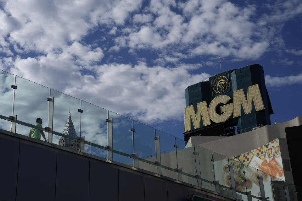 People walk by the MGM Grand hotel-casino Wednesday, Sept. 13, 2023, in Las Vegas. Casino operator MGM Resorts International said Tuesday that resorts are open and an investigation is continuing after what it called a “cybersecurity issue” led to the shutdown of computer systems at company properties across the U.S. (AP Photo/John Locher)