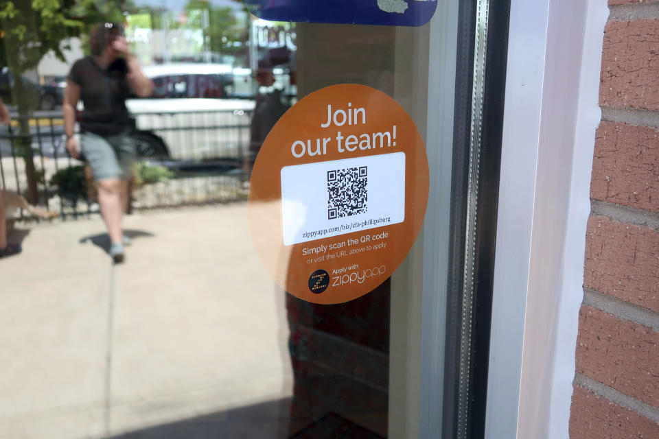 In this May 25, 2018, photo, a decal with a QR code at the entrance to a Chick-fil-A in Phillipsburg, N.J.,invites people to apply for work at the restaurant. On Tuesday, June 5, the Labor Department reports on job openings and labor turnover for April. (AP Photo/Ted Shaffrey)