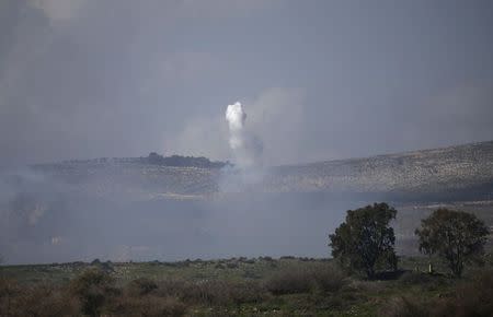 Smoke rises after an explosion near the village of Ghajar on the Israeli-Lebanese border January 28, 2015. REUTERS/Baz Ratner