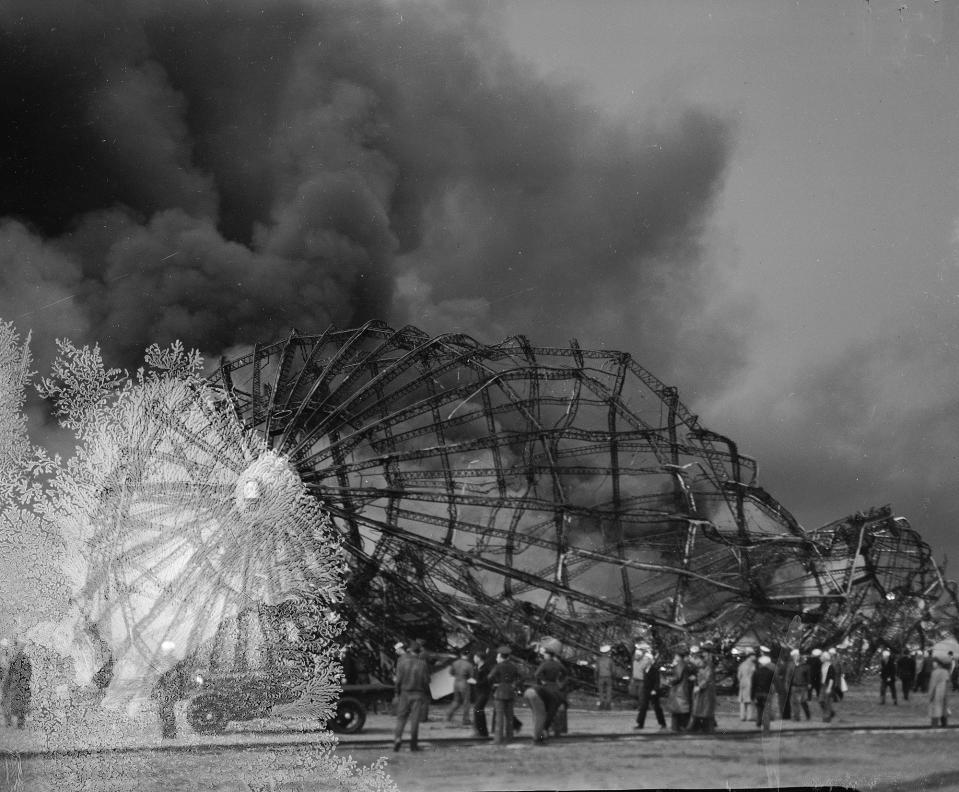 <p>Clouds of smoke rise from the twisted metal frame of the German airship Hindenburg as rescue workers arrive to look for possible survivors, May 6, 1937, in Lakehurst, N.J. The Hindenburg exploded as it was mooring at the Lakehurst Naval Air Station. (AP Photo) </p>