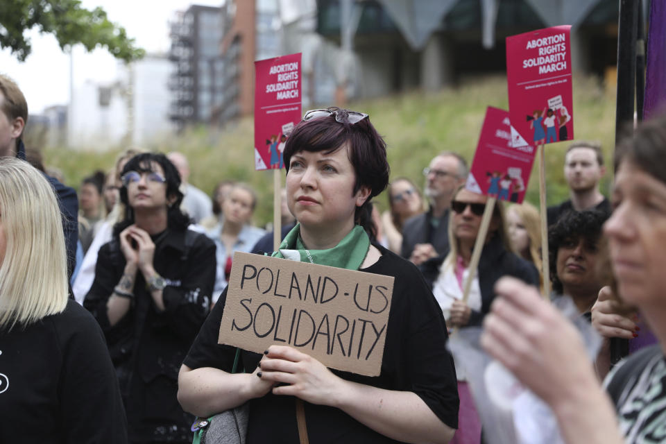 Demonstrators gather outside the United States embassy in Vauxhall to protest against the decision to scrap constitutional right to abortion, in London, Friday June 24, 2022. The Supreme Court has ended constitutional protections for abortion that had been in place nearly 50 years — a decision by its conservative majority to overturn the court's landmark abortion cases. Friday’s outcome overturning Roe v. Wade is expected to lead to abortion bans in roughly half the states. (Ashlee Ruggels/PA via AP)