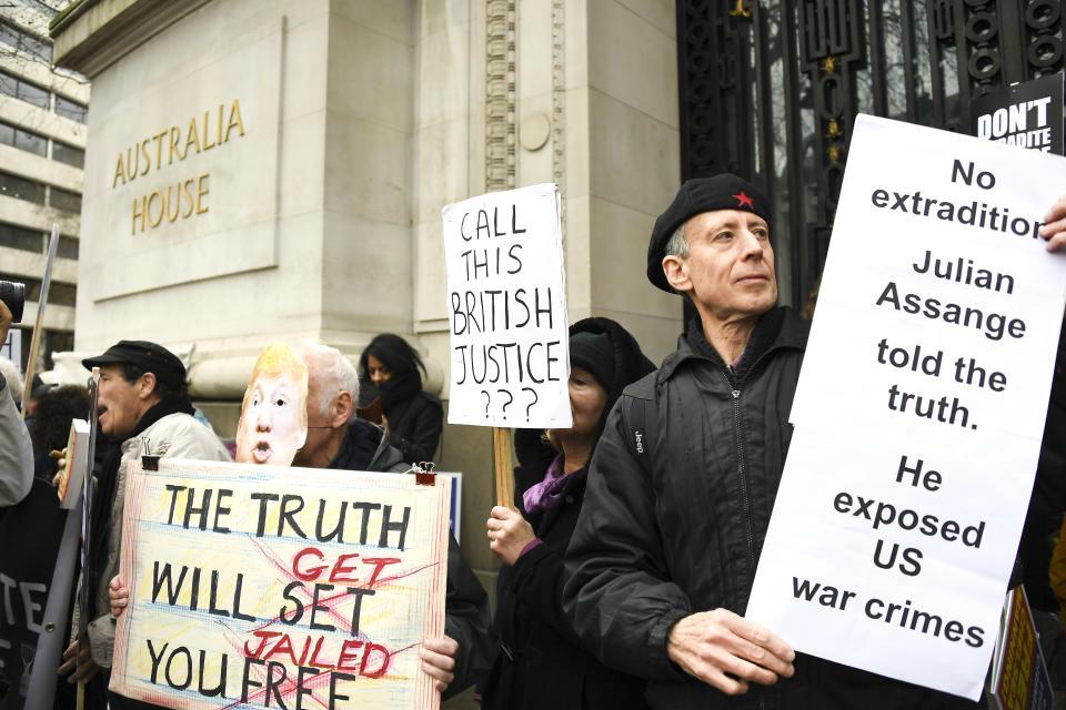 Demonstrators gather outside Australia House to protest against the extradition of Wikileaks founder Julian Assange, in London, Saturday, Feb. 22, 2020. Assange is fighting extradition to the United States on spying charges. (AP Photo/Alberto Pezzali)