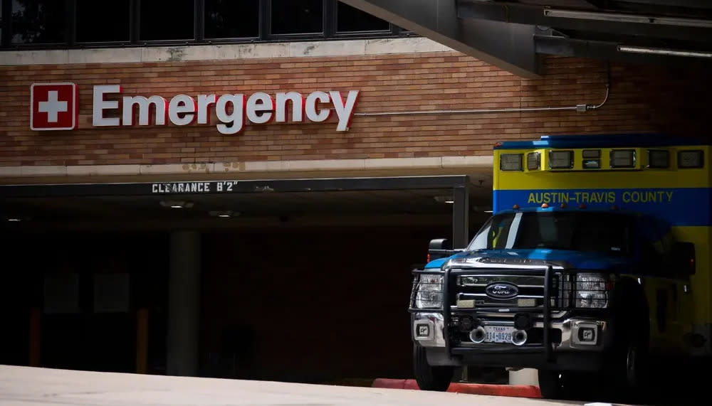 Austin-Travis County EMS unit parked near a hospital's emergency entrance in Austin, Texas