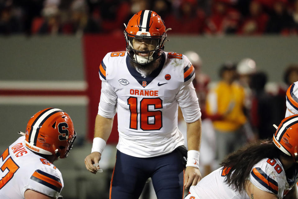 FILE - Syracuse's Garrett Shrader (16) prepares the offense to snap the ball against North Carolina State during the second half of an NCAA college football game in Raleigh, N.C., Saturday, Nov. 20, 2021. Syracuse is set to kick off its season on Sept. 3, 2022, against Louisville. (AP Photo/Karl B DeBlaker, File)