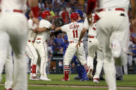 St. Louis Cardinals' Yadier Molina, second from left, is held back by teammate Matt Carpenter during a bench-clearing argument after Molina was hit by a pitch during the second inning of a baseball game against the Chicago Cubs, Saturday, Sept. 28, 2019, in St. Louis. (AP Photo/Scott Kane)