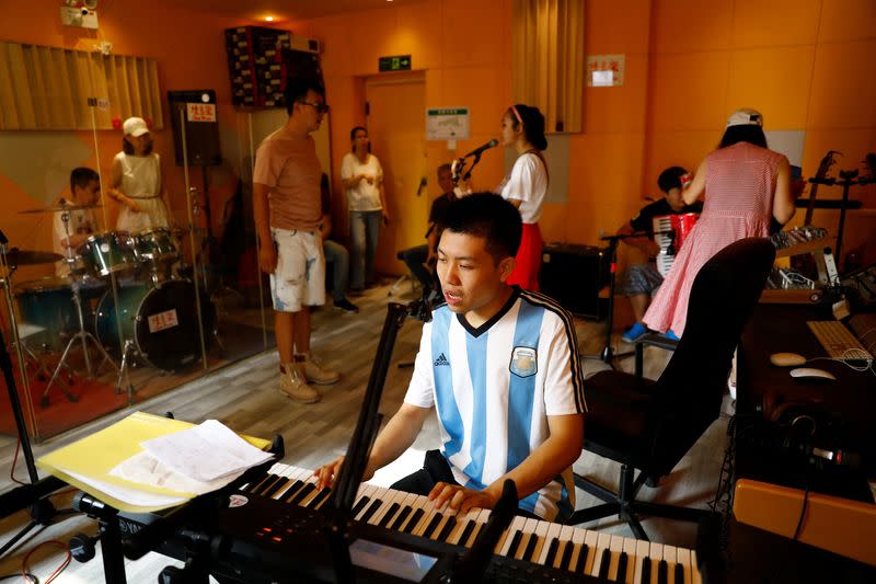 The Wider Image: "Music is their language": school gives autistic Chinese youth a voice