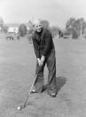 <p>Bing Crosby hits a couple of golf balls during a filming break, circa 1930.</p>