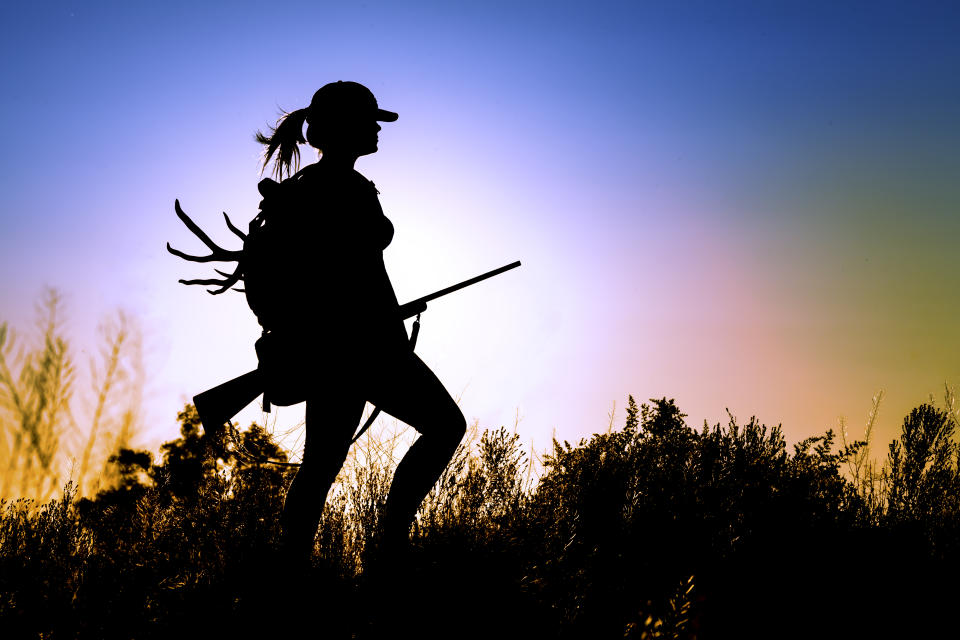 young Lady on a Deer Hunt at sun sunset