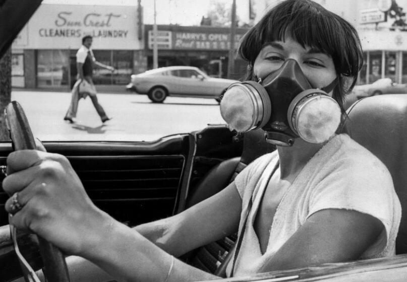 June 29, 1979: Sera Segal-Alsberg wears a mask designed to filter out airborne particles during a Los Angeles smog alert.