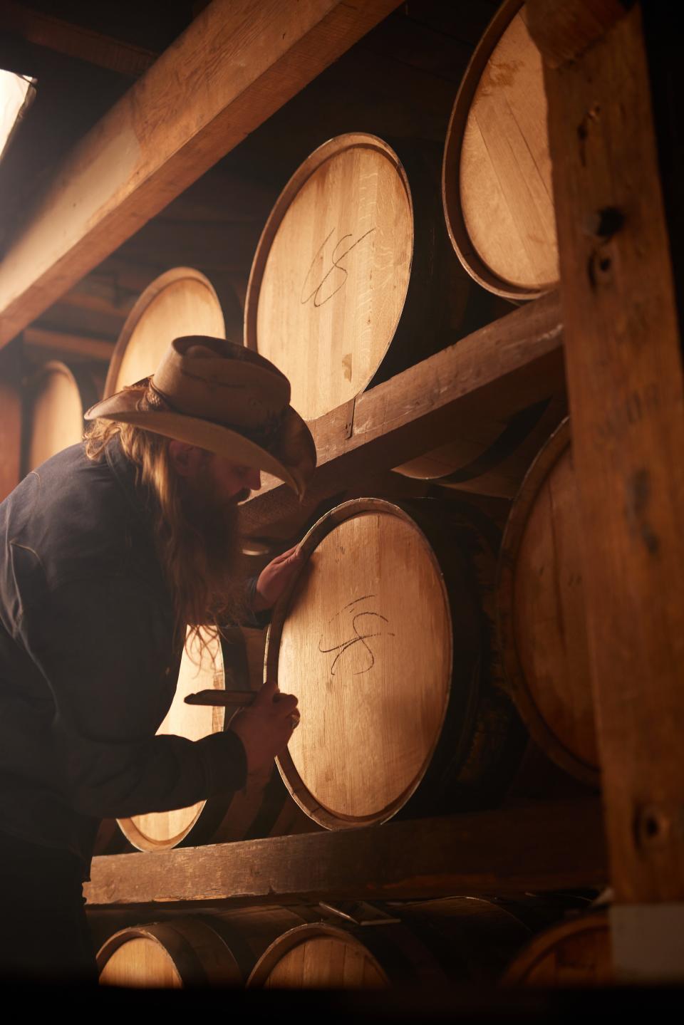 Chris Stapleton teamed with Buffalo Trace on Traveller Whiskey. Here he is at the distillery signing some barrels.