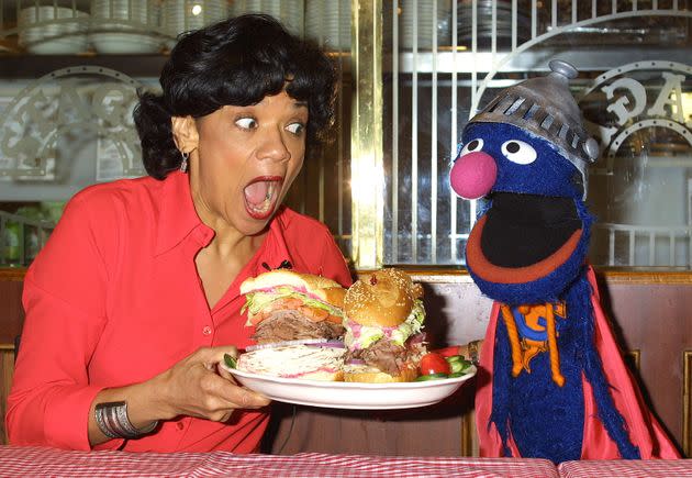 The author and the Muppet Grover launch the Super Grover sandwich in honor of the 4,000th 