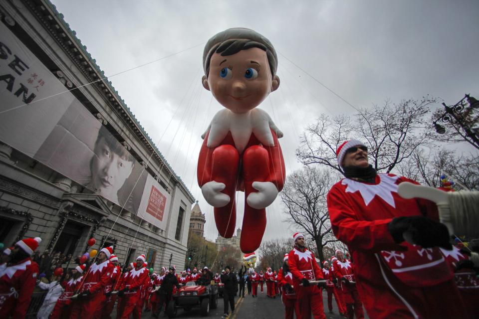 The Elf on the Shelf balloon floats down Central Park West during the 88th Macy's Thanksgiving Day Parade in New York