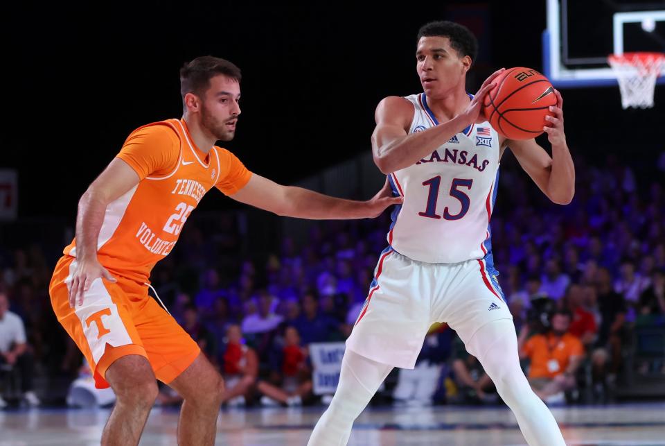 Kansas guard Kevin McCullar Jr. (15) looks to pass as Tennessee guard Santiago Vescovi (25) defends during the first half of a Friday game in the Bahamas at Imperial Arena.