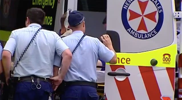 The injured officer was rushed to St Vincent Hospital where police officers waited to escort him inside. Source: 7 News