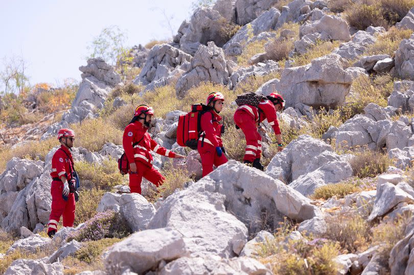 The Greek Red Cross seen on the hills between the towns of Symi and Pedi looking for missing doctor Michael Mosley