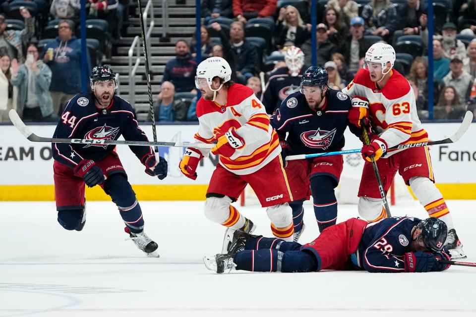 Oct 20, 2023; Columbus, Ohio, USA; Columbus Blue Jackets defenseman Erik Gudbranson (44) goes after Calgary Flames defenseman Rasmus Andersson (4) after he hit Columbus Blue Jackets right wing Patrik Laine (29) late in the third period of the NHL hockey game at Nationwide Arena. The Blue Jackets on 3-1.