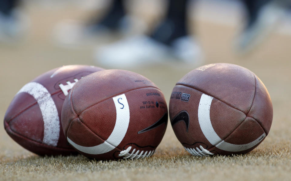 Virginia Tech said a former assistant coach got proprietary info. (AP)