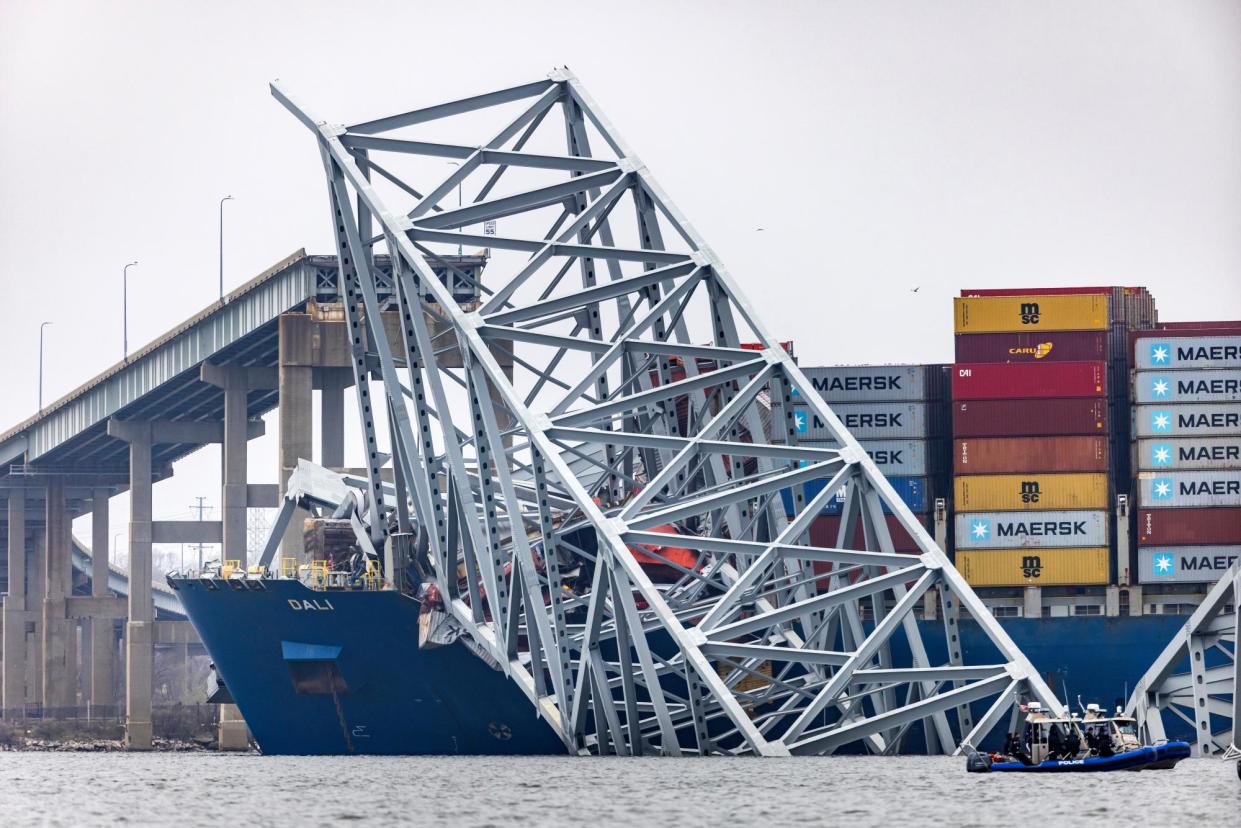 <span>Wreckage from the Francis Scott Key Bridge remains on top of the cargo ship Dali in Baltimore, Maryland, on Wednesday.</span><span>Photograph: Jim Lo Scalzo/EPA</span>