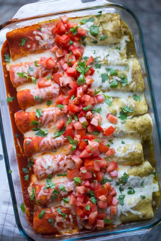 <p>Lauren's Latest</p><p>Filled with shredded cheese, chicken and salsa, these will become your newest family-favorite Mexican dinner.</p><p><strong>Get the recipe: <a href="https://laurenslatest.com/red-and-green-enchiladas/" rel="nofollow noopener" target="_blank" data-ylk="slk:Red and Green Enchiladas;elm:context_link;itc:0;sec:content-canvas" class="link rapid-noclick-resp">Red and Green Enchiladas</a></strong></p>