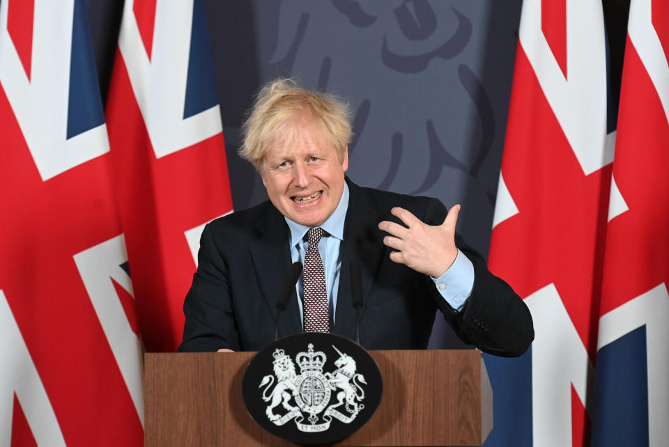 Britain's Prime Minister Boris Johnson speaks during a media briefing in Downing Street, London, Thursday, Dec. 24, 2020. Britain and the European Union have struck a provisional free-trade agreement that should avert New Year's chaos for cross-border commerce and bring a measure of certainty to businesses after years of Brexit turmoil. The breakthrough on Thursday came after months of tense and often testy negotiations that whittled differences down to three key issues: fair-competition rules, mechanisms for resolving future disputes and fishing rights. (Paul Grover/Pool Photo via AP)