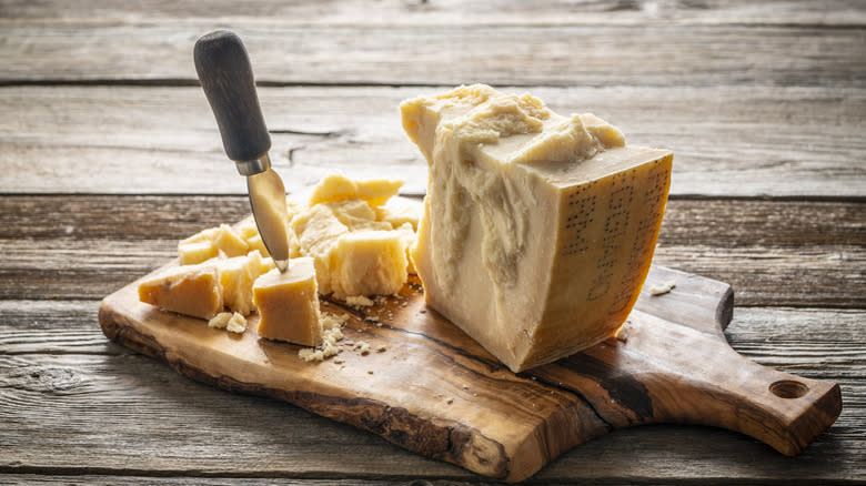 crumbled parmesan cheese with knife