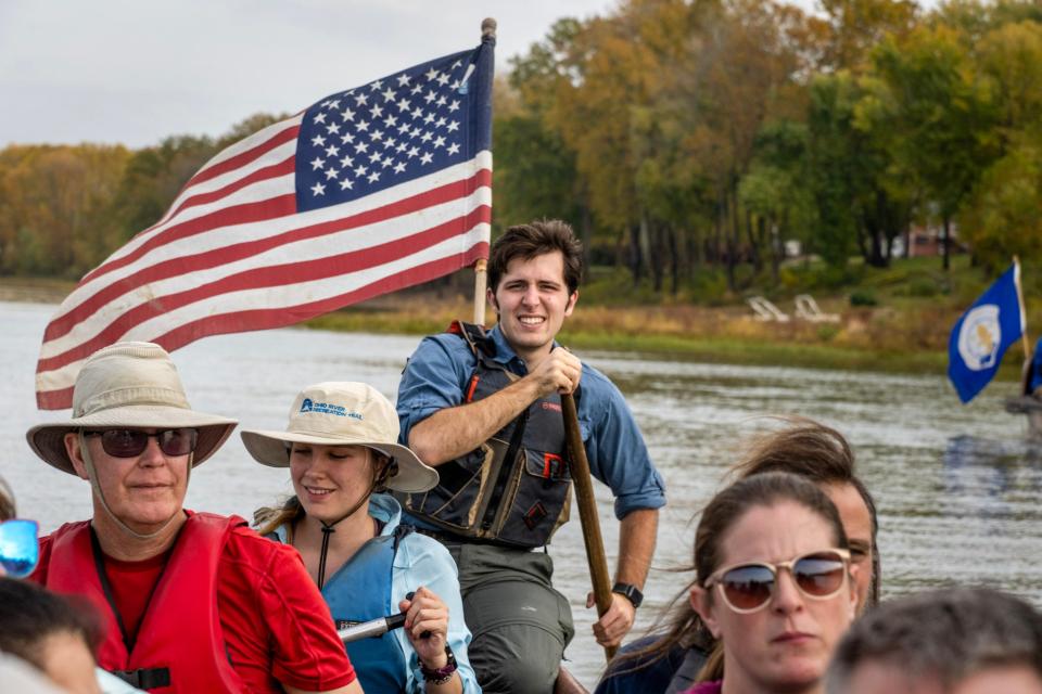 Forest Clevenger captaining a voyageur canoe on the Ohio River.