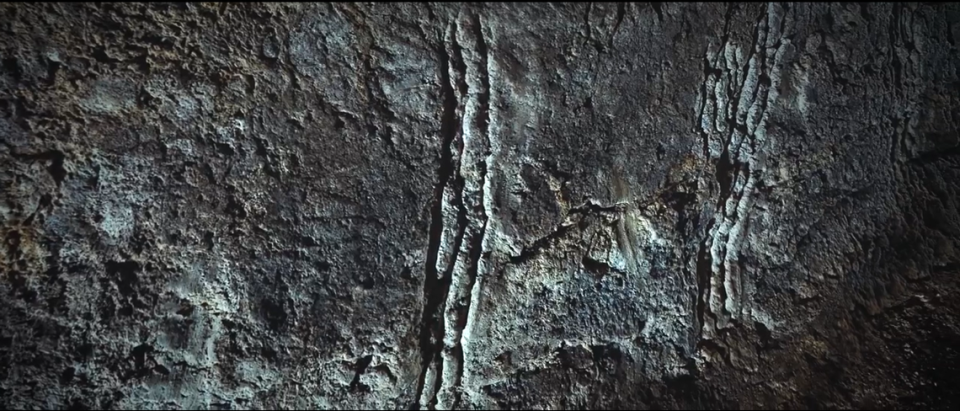 The claw marks found in the cavern.