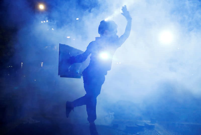 FILE PHOTO: An anti-government protester is seen during clashes with the police outside the Polytechnic University in Hong Kong