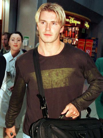 <p>EPA/Shutterstock</p> David Beckham after the English team's return from the 1998 FIFA World Cup.