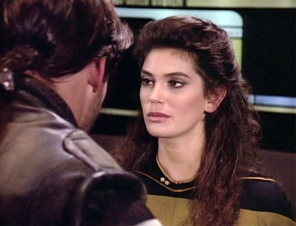 <p>She may not have received an onscreen credit, but Hatcher’s appearance on a 1988 episode of <em>TNG</em> is real… and it’s spectacular. The future <em>Lois & Clark</em> star played transporter chief, B.G. Robinson, who beamed Bill “The Rocketeer” Campbell’s space rogue, Thadiun Okona, aboard Picard’s Enterprise and — it’s heavily implied — had a private meeting with him in her quarters later on.<br><br>(Photo: Getty Images/CBS) </p>