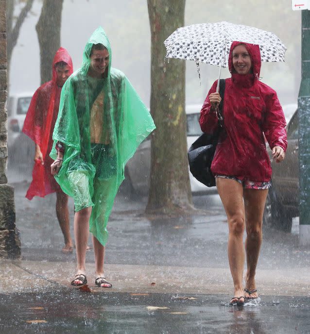 Sydney copped a dumping of rain, but the heat will bear down on the city by week's end. Source: AAP