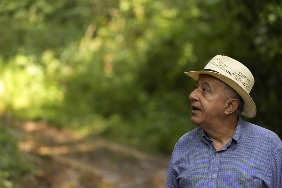 Judson Ferreira Valentim, researcher at the Agricultural Research Corporation, EMBRAPA, walks through the forest of a research center in the city of Rio Branco, Acre state, Brazil, Wednesday, May 24, 2023. “The biodiversity is rich, but so many people are very poor,” he says. Valentim is focused on helping farmers and ranchers — especially small operators — find low-cost solutions to improve their livelihoods. (AP Photo/Eraldo Peres)