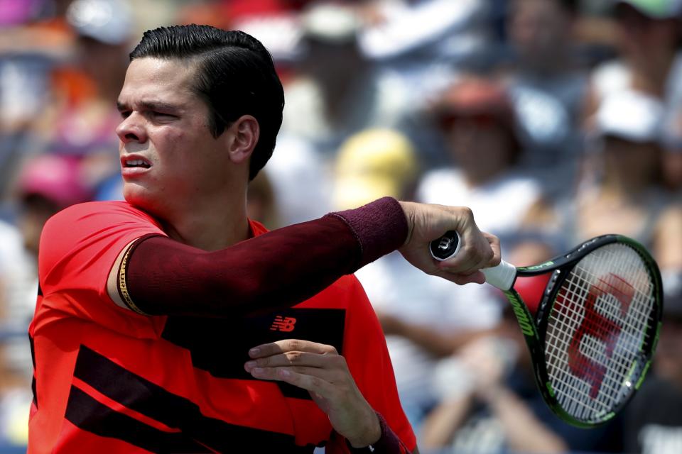 Milos Raonic of Canada hits a return to Fernando Verdasco of Spain during their match at the U.S. Open Championships tennis tournament in New York, September 2, 2015. REUTERS/Mike Segar