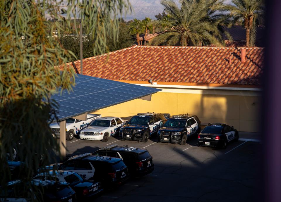 Cathedral City Police Department vehicles are seen parked in a lot behind the station in Cathedral City, Calif., Friday, Dec. 23, 2022. 