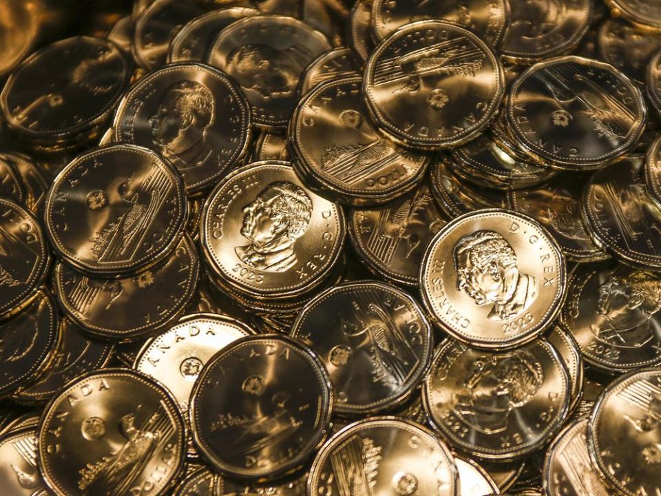  Loonies with the effigy of King Charles are struck at an event at the Royal Canadian Mint in Winnipeg.