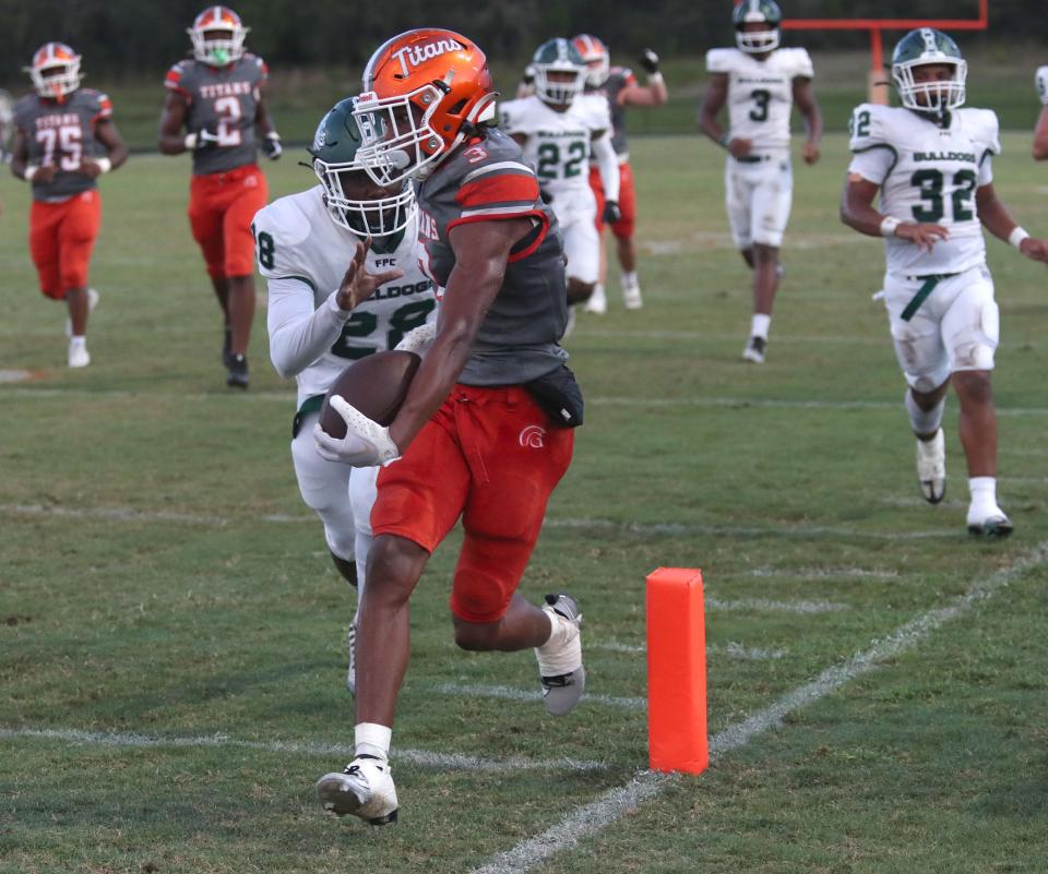 University's Jermane Hayes (3) steps into the end zone as Flagler Palm Coast's defense chases him, Thursday, Sept. 21, 2023.