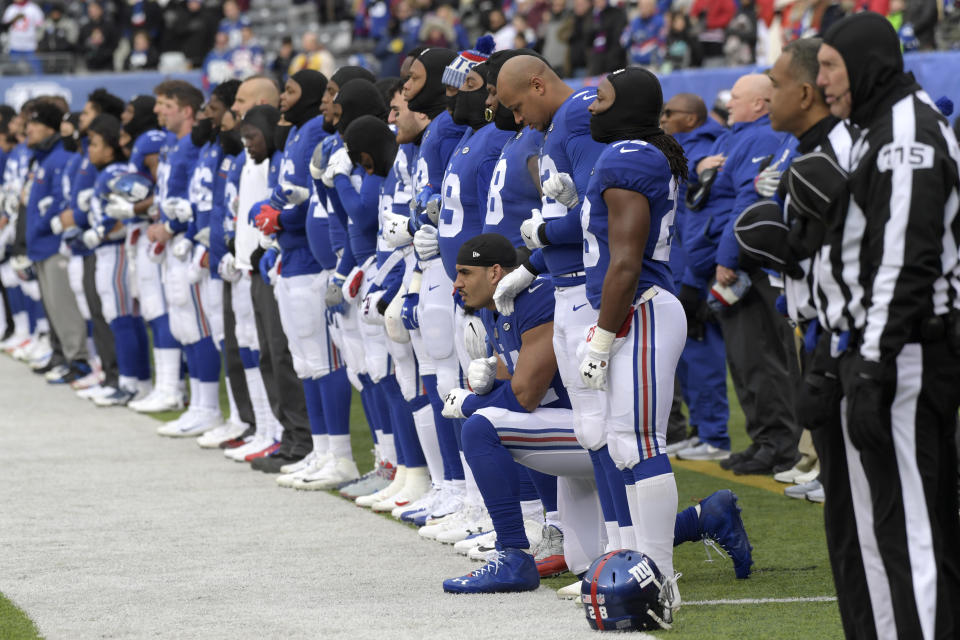 New York Giants defensive end Olivier Vernon kneels during the national anthem before last year's season finale. (AP)
