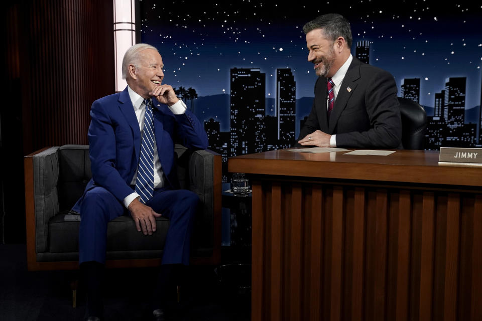 President Joe Biden laughs with host Jimmy Kimmel during a commercial break during the taping of Jimmy Kimmel Live!, Wednesday, June 8, 2022, in Los Angeles prior to attending the Summit of the Americas. (AP Photo/Evan Vucci)